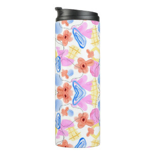 A travel mug with a colourful, abstract symmetrica