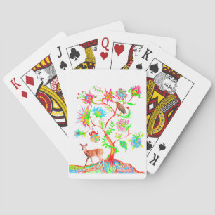 A tree, a bird, and a fawn playing cards