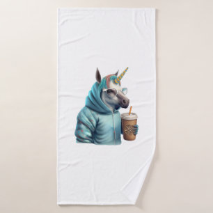 A unicorn with a hoodie drinks a coffee. 1 bath towel