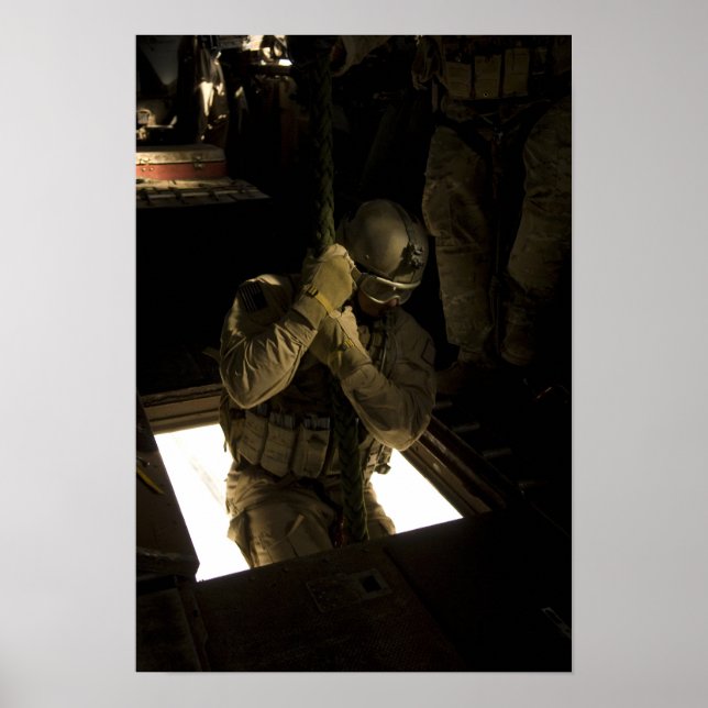 A US Air Force pararescueman begins his descent Poster (Front)