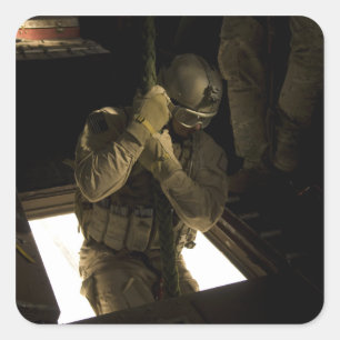 A US Air Force pararescueman begins his descent Square Sticker
