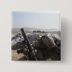 A US Marine fires a mortar in Salinas, Peru 15 Cm Square Badge