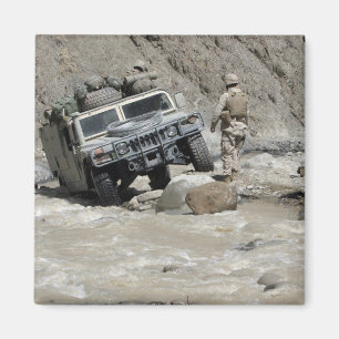 A US Marine guiding the driver of a Humvee Magnet