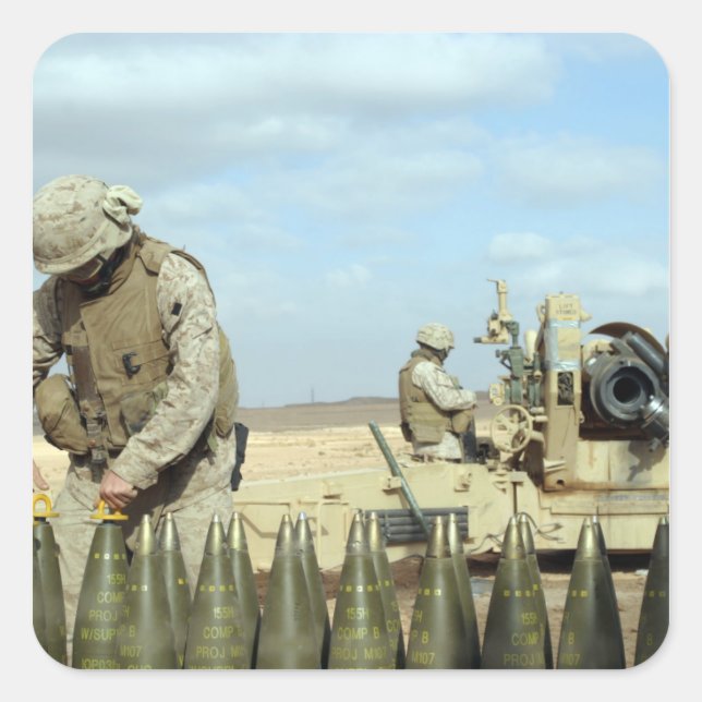 A US Marine prepares howitzer rounds to be fire Square Sticker (Front)