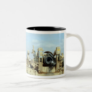 A US Marine prepares howitzer rounds to be fire Two-Tone Coffee Mug