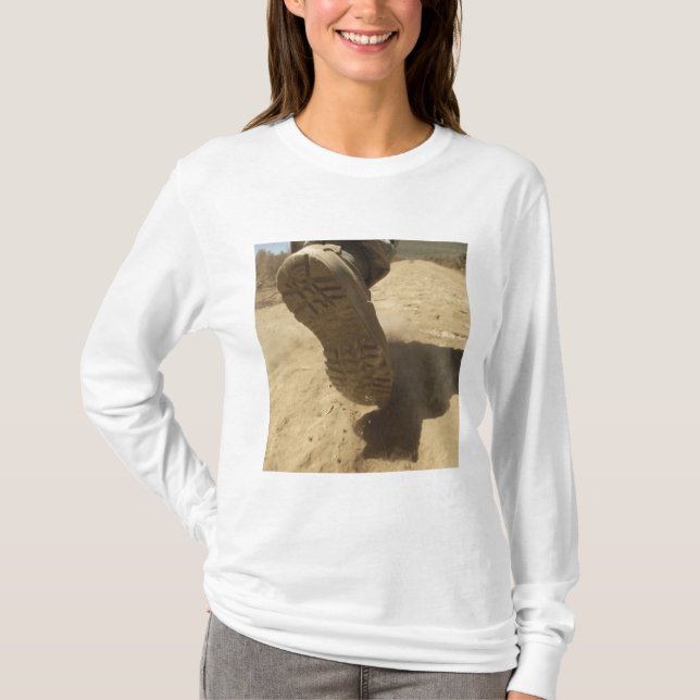 A US soldier walks along a dirt path T-Shirt (Front)