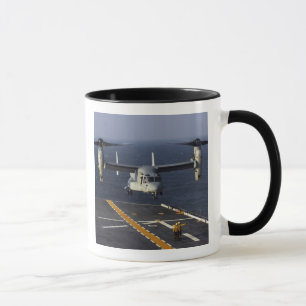 A V-22 Osprey aircraft prepares to land Mug