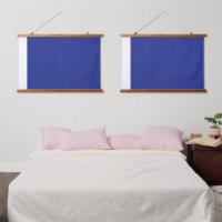 A vibrant blue backdrop with a clean white square 