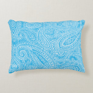A vibrant blue fabric featuring intricate patterns decorative cushion