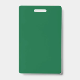 A vibrant green leaf with distinct veins is illumi ID badge