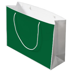 A vibrant green leaf with distinct veins is illumi large gift bag