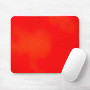 A vibrant red and orange rectangular placemat mouse mat