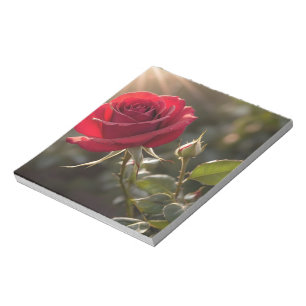 A vibrant red rose, symbolising love and passion notepad