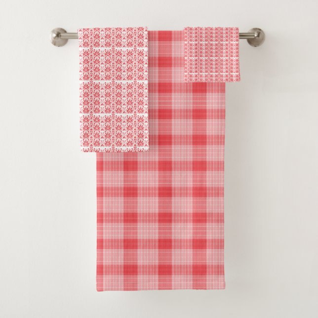 A vibrant red rose with dewdrops gently resting on bath towel set (Insitu)