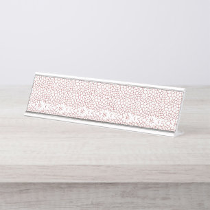 A vibrant rug featuring an intricate geometric mot desk name plate