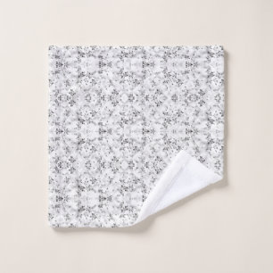 A visually striking white and black patterned wall bath towel set