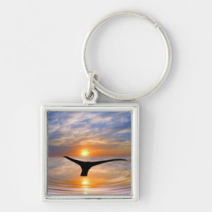 A whales tail at sunset key ring
