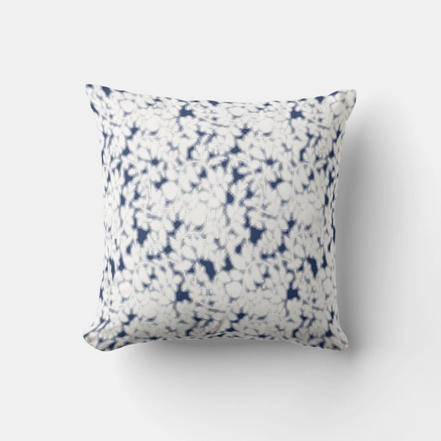 a white and blue background with a pattern cushion (Front)
