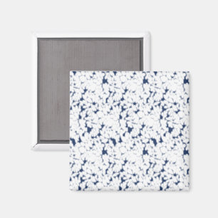 a white and blue background with a pattern magnet