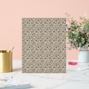 a white and brown background with small brown dots acrylic sign