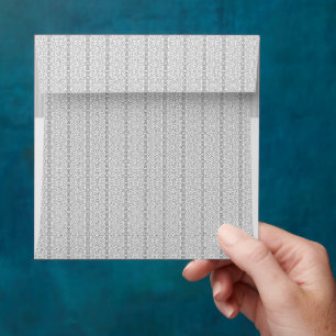 a white and grey wallpaper with a pattern on it envelope
