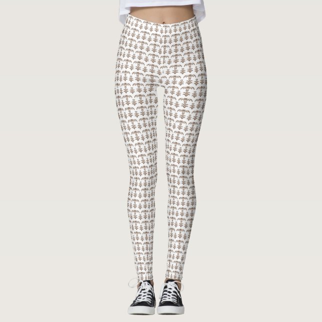 a white background with a brown pattern on it leggings (Front)