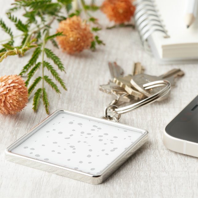 a white background with a lot of small dots key ring (Side)