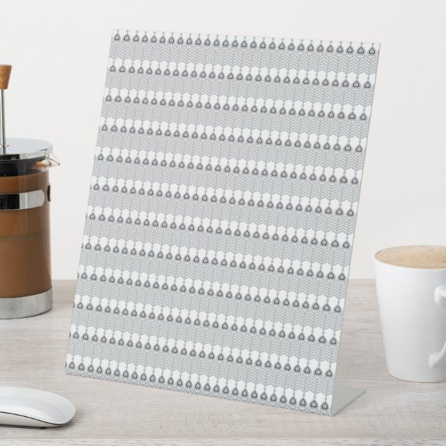  a white background with a pattern of circles pedestal sign (In SItu)