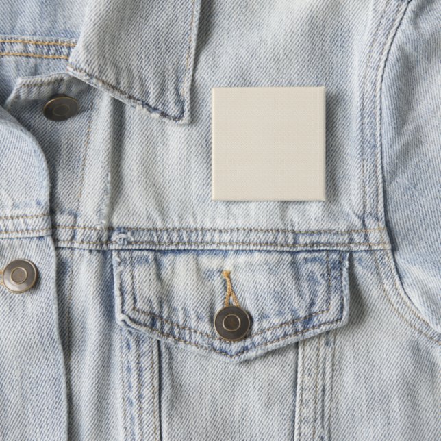 a white background with a pattern of small dots 15 cm square badge (In Situ)