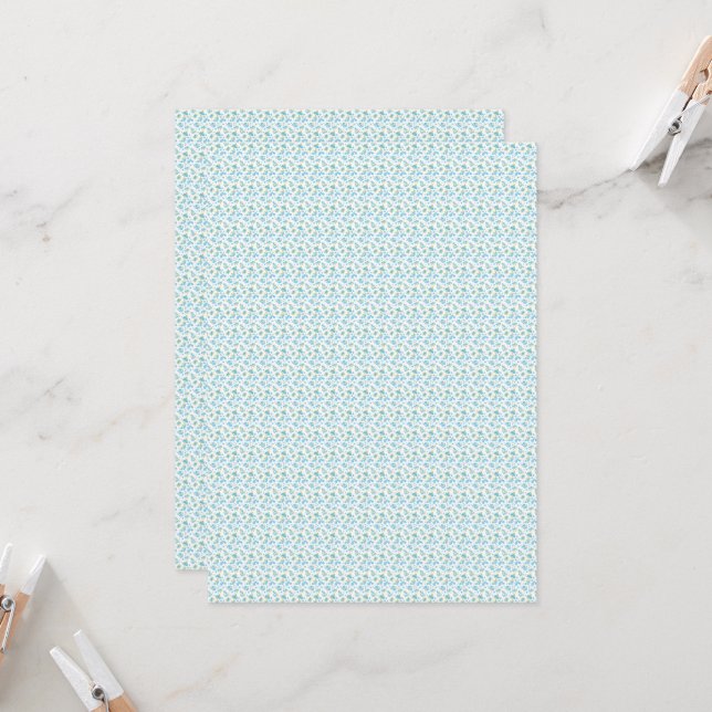 a white background with blue flowers and green lea invitation (Front/Back In Situ)