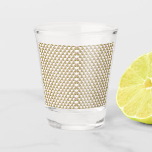 a white background with green leaves on it shot glass
