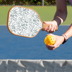 a white background with lots of drops of water pickleball paddle