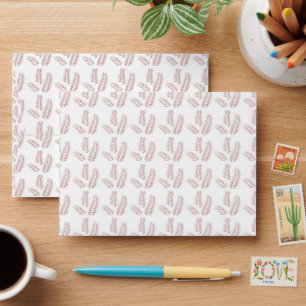 a white background with pink leaves on it envelope