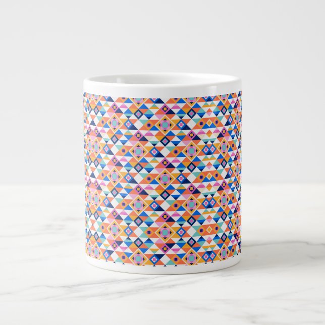 A white ceramic mug features a colorful geometric  (Front)