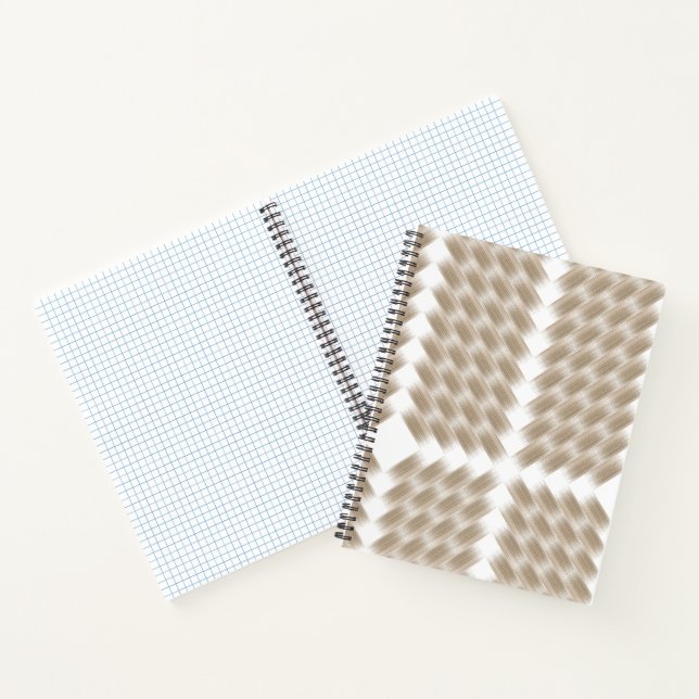 A white, equilateral triangle centred on a plain  notebook (Inside)