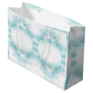 A white gift bag with teal watercolor-like swirls