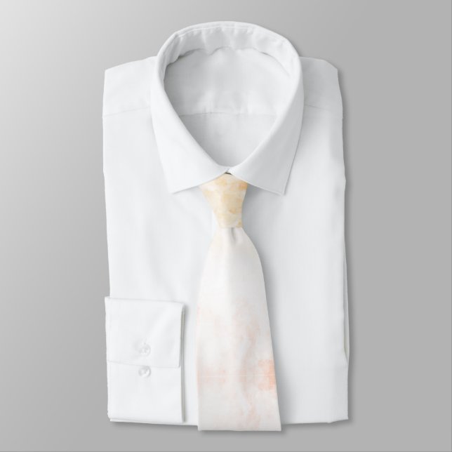 A white necktie with subtle orange and pink  (Tied)
