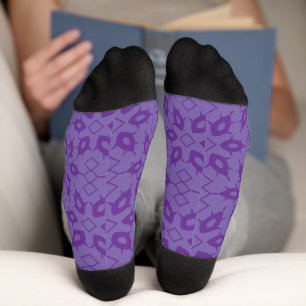 A white wrapping paper with a repeating pattern of socks