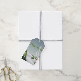 A winter day with a Christmas tree covered snow Gift Tags