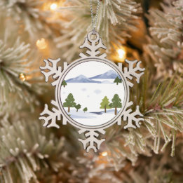 A winter wonderland scene with snow-covered trees, snowflake pewter christmas ornament