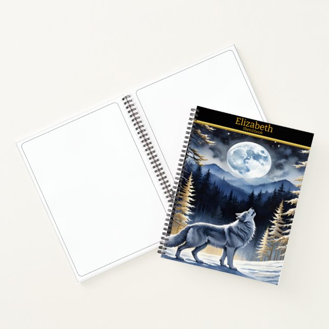 A wolf howls beneath a full moon in a snowy forest notebook (Inside)
