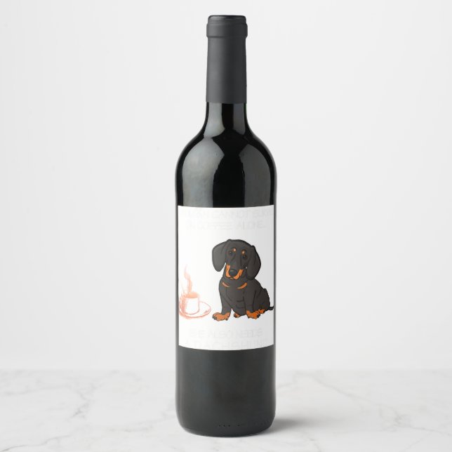 A Woman Cannot Survive On Coffee Alone Dachshund D Wine Label (Front)