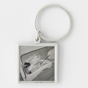 A woman driving, c.1930s (photogravure) key ring