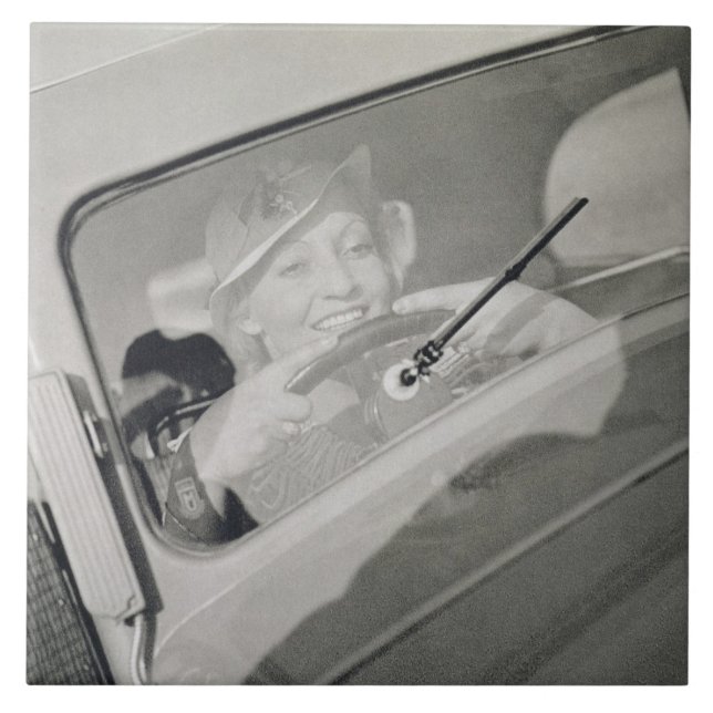 A woman driving, c.1930s (photogravure) tile (Front)