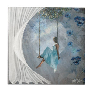 A woman in a blue dress on a swing tile