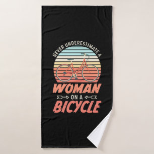 A Woman On A Bicycle Bath Towel