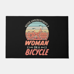 A Woman On A Bicycle Doormat