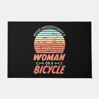 A Woman On A Bicycle Doormat