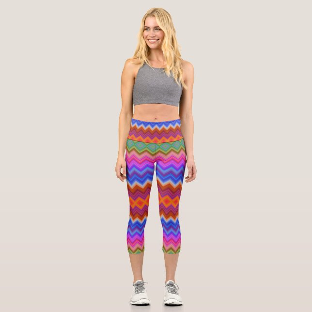 A woman wears vibrant, zigzag-patterned leggings  (Front)