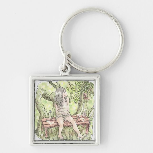 a woman's illustration sitting on a couch on a gia key ring (Front)